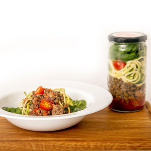 serving of Zucchini Beef Houdini next to a jar